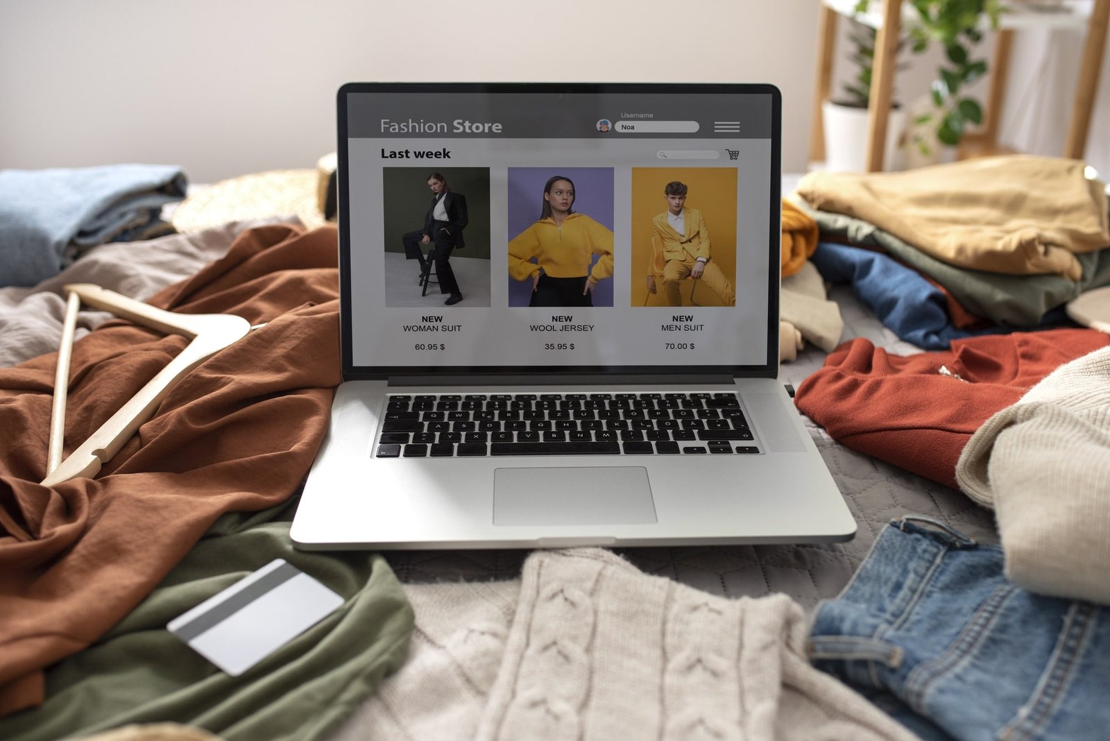 high-angle-clothes-bed-fast-fashion-concept-min